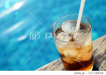 A glass of ice cola at pool with vintage filter 22718058