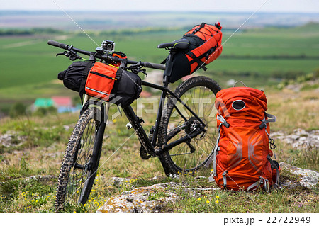 Bicycle with orange bags for travel 22722949