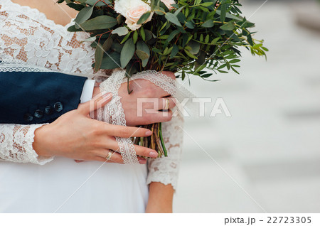 bride and groom together holding wedding bouquet bride and groom together holding wedding bouquet 22723305