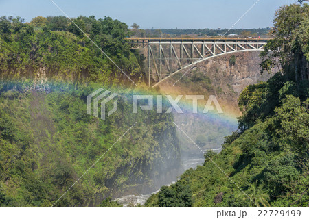 Close-up of Victoria Falls Bridge over rainbow 22729499