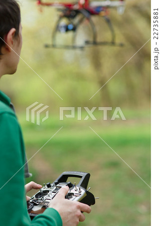 Man controling a drone. 22735881