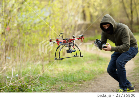 Man flying with the drone 22735900