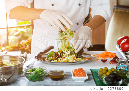 Male hands preparing salad. Male hands preparing salad. 22738094