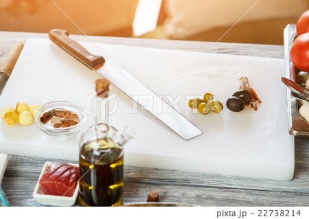 Olives on white cooking board. Olives on white cooking board. 22738214