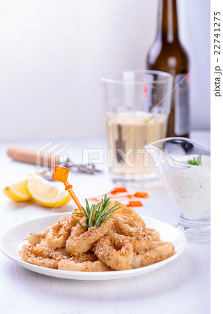 Fried squid rings with lemon, herbs and spices Fried squid rings with lemon, herbs and spices 22741275