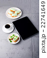 Mint eclairs on a plate, coffee and digital tablet 22741649