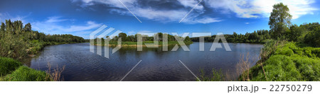 Wide panorama of a river and the forested 22750279