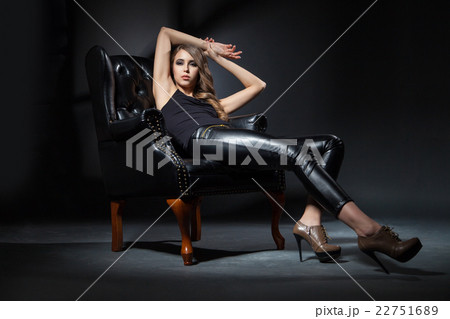 Beautiful brunette in black leather chair Beautiful brunette in black leather chair 22751689