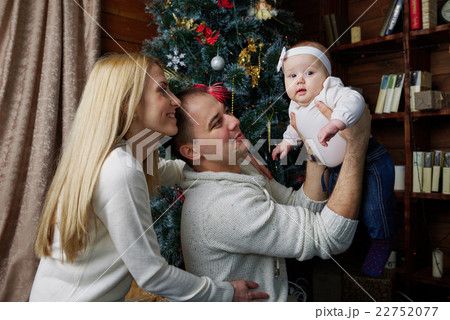 happy family in christmas decorated room 22752077