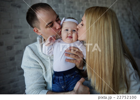 happy father and mother with baby 22752100