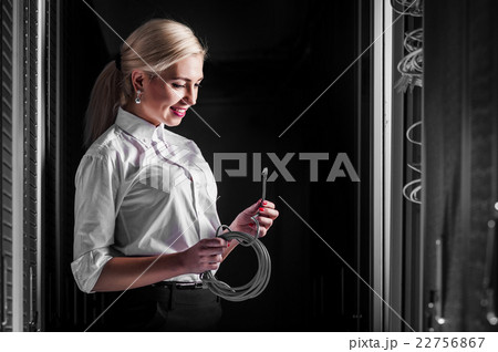 Young engineer businesswoman in server room Young engineer businesswoman in server room 22756867