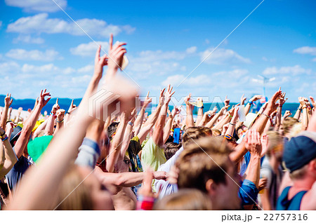 Teenagers at summer music festival clapping and Teenagers at summer music festival clapping and 22757316