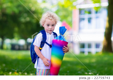 Little child with candy cone on first school day Little child with candy cone on first school day 22759743