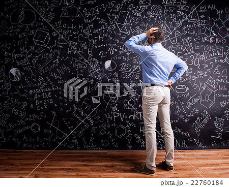 Hipster teacher against big blackboard with Hipster teacher against big blackboard with 22760184