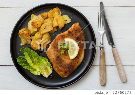 Schnitzel with potatoes salad and lemon Schnitzel with potatoes salad and lemon 22760272