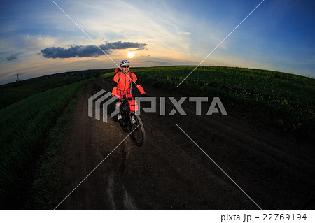Young man is riding bicycle outside. Healthy Young man is riding bicycle outside. Healthy 22769194