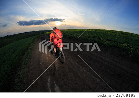 Young man is riding bicycle outside. Healthy Young man is riding bicycle outside. Healthy 22769195
