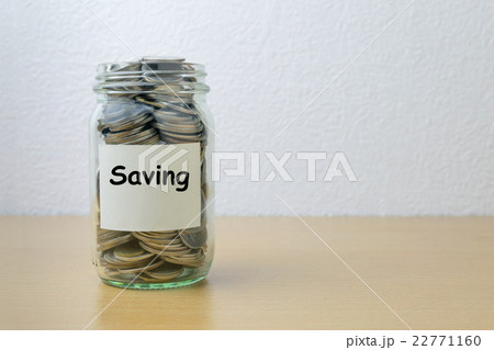 Money saving for savings in the glass bottle 22771160