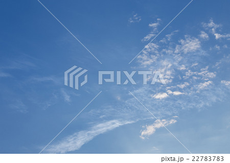 wind blows clouds in blue sky background 22783783