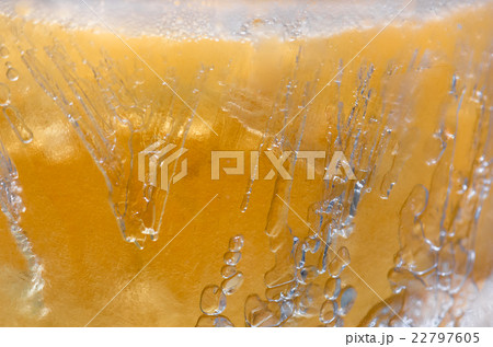 Bubbles in a frozen beer close Bubbles in a frozen beer close 22797605