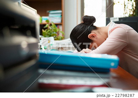 Tired businesswoman sleeping on the desk. Tired businesswoman sleeping on the desk. 22798287