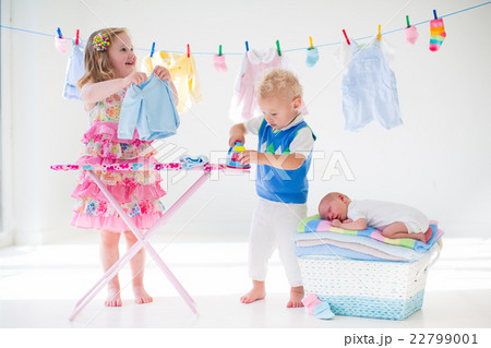 Kids ironing clothes for baby brother Kids ironing clothes for baby brother 22799001