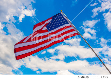 American flag on blue sky . American flag on blue sky . 22804395
