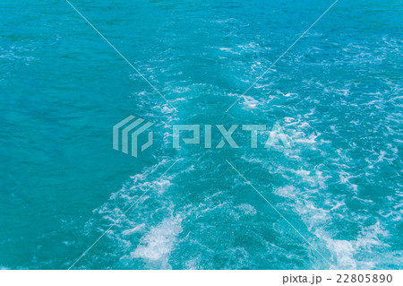Trail on sea water surface behind boat Trail on sea water surface behind boat 22805890