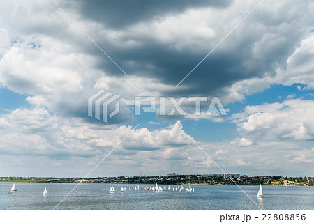 low dramatic sky over river with little yachts low dramatic sky over river with little yachts 22808856