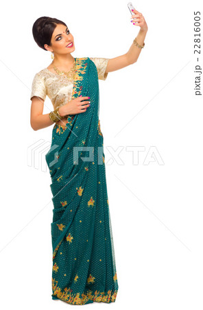 Indian woman with mobile phone Indian woman with mobile phone 22816005