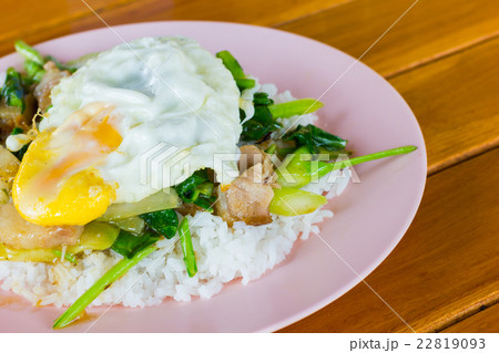 Fried meat with kale and egg with rice Fried meat with kale and egg with rice 22819093