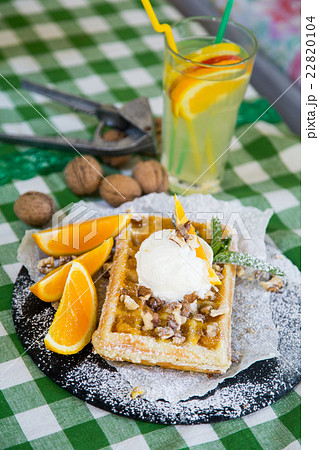 Belgian waffle with honey sauce, oranges, walnuts, 22820104