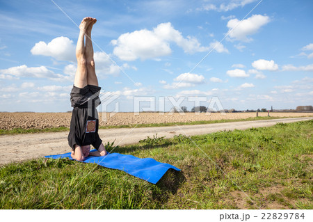 Enjoy Mukta Hasta Sirsasana yoga in Nature 22829784