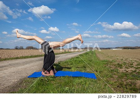 Enjoy Mukta Hasta Sirsasana yoga in Nature 22829789
