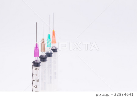 syringe with needle.syringe with color needle. syringe with needle.syringe with color needle. 22834641