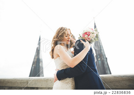 Stylish beautiful wedding couple kissing and Stylish beautiful wedding couple kissing and 22836836