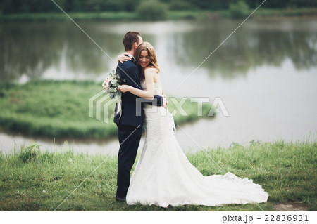 Romantic wedding couple, man and wife, posing near Romantic wedding couple, man and wife, posing near 22836931