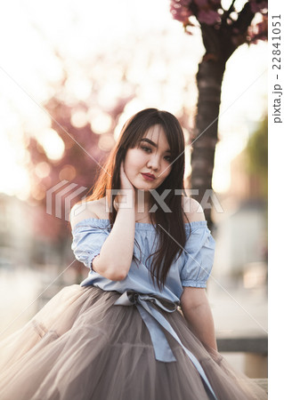 Young Asians girl with modern dress posing in an Young Asians girl with modern dress posing in an 22841051