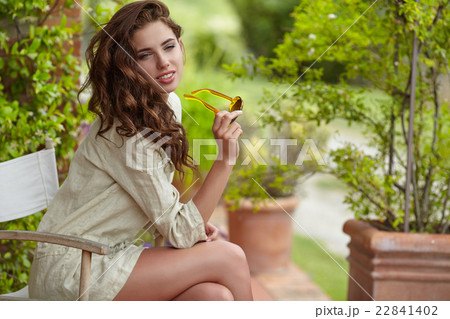 Woman smiling happy on sunny summer day outs 22841402