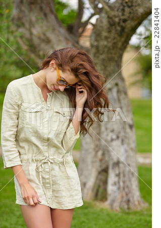 Woman smiling happy on sunny summer day outs 22841404