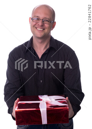 caucasian guy gives a gift isolated on white 22841762