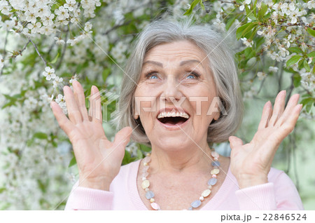 Older woman with flowers Older woman with flowers 22846524
