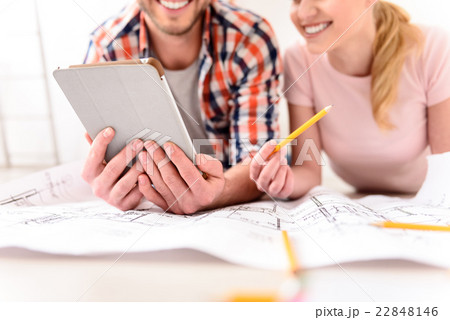 Smiling couple looking at tablet 22848146