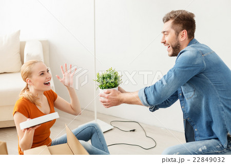 Happy couple unpacking boxes 22849032