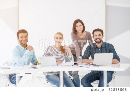 Group of young colleagues having meeting at office 22853868