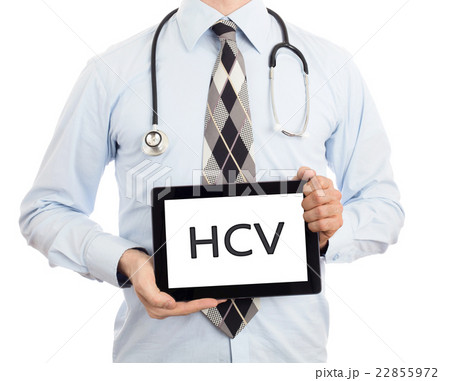 Doctor holding tablet - HCV 22855972