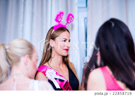 Cheerful bride and bridesmaids celebrating hen 22858719