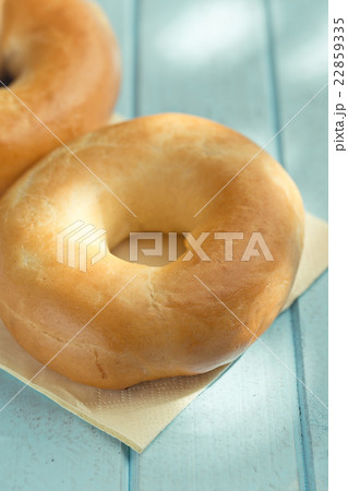 tasty bagels on kitchen table 22859335