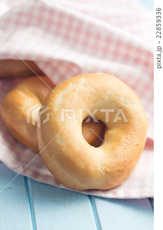 tasty bagels on kitchen table 22859336