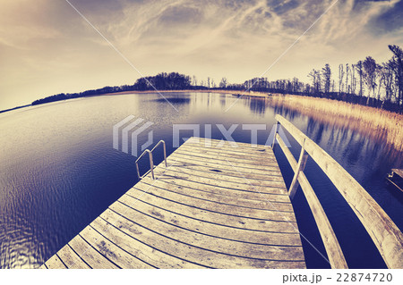 Vintage toned fisheye lens picture of a pier. 22874720